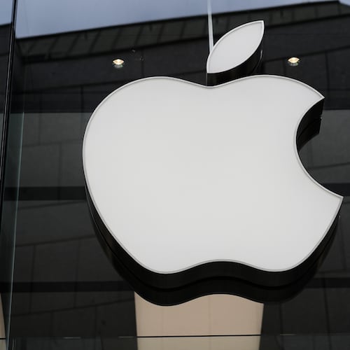 FILE - The Apple logo is illuminated at a store in Munich, Germany, April 2, 2026. (AP Photo/Matthias Schrader, File)