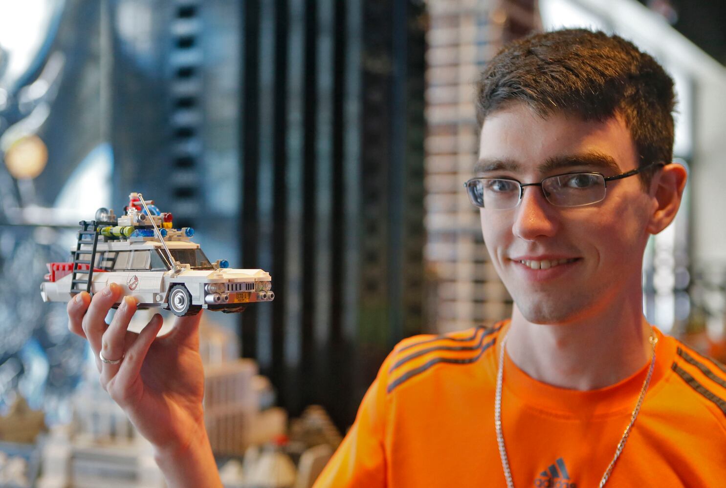 Father and son build giant Lego cityscape