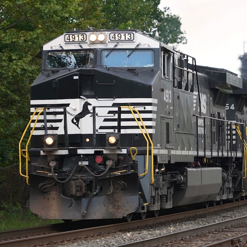 FILE - A Norfolk Southern freight train rolls past the U.S. Steel's Clairton Coke Works, in Clairton, Pa., Tuesday, Aug. 12, 2025. (AP Photo/Gene J. Puskar, File)