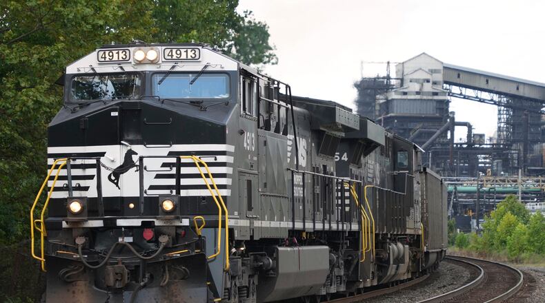 FILE - A Norfolk Southern freight train rolls past the U.S. Steel's Clairton Coke Works, in Clairton, Pa., Tuesday, Aug. 12, 2025. (AP Photo/Gene J. Puskar, File)