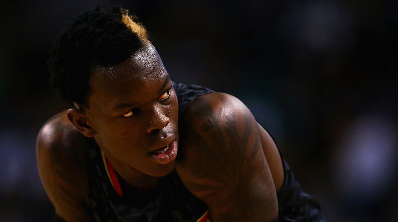 BOSTON, MA - DECEMBER 18: Dennis Schroder #17 of the Atlanta Hawks looks on during the second quarter against the Boston Celtics at TD Garden on December 18, 2015 in Boston, Massachusetts.NOTE TO USER: User expressly acknowledges and agrees that, by downloading and/or using this photograph, user is consenting to the terms and conditions of the Getty Images License Agreement. (Photo by Maddie Meyer/Getty Images)