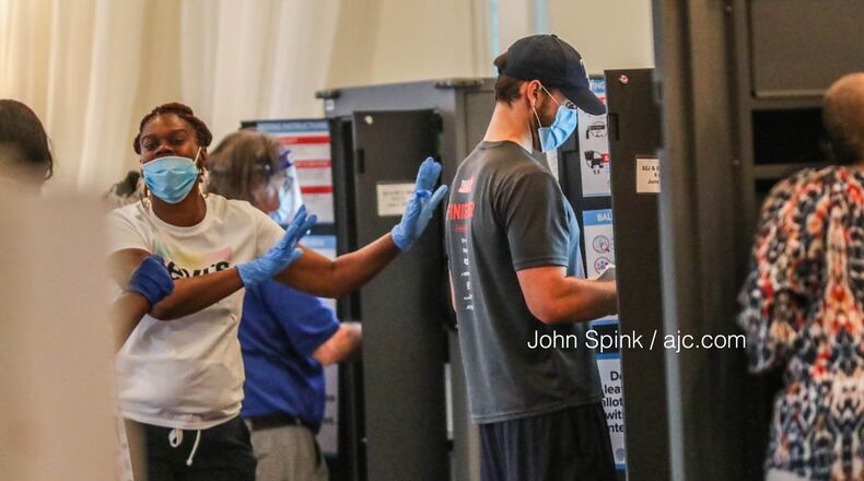 Voters cast ballots at Park Tavern in Midtown Atlanta on Tuesday, June 9, 2020. JOHN SPINK / JOHN.SPINK@AJC.COM