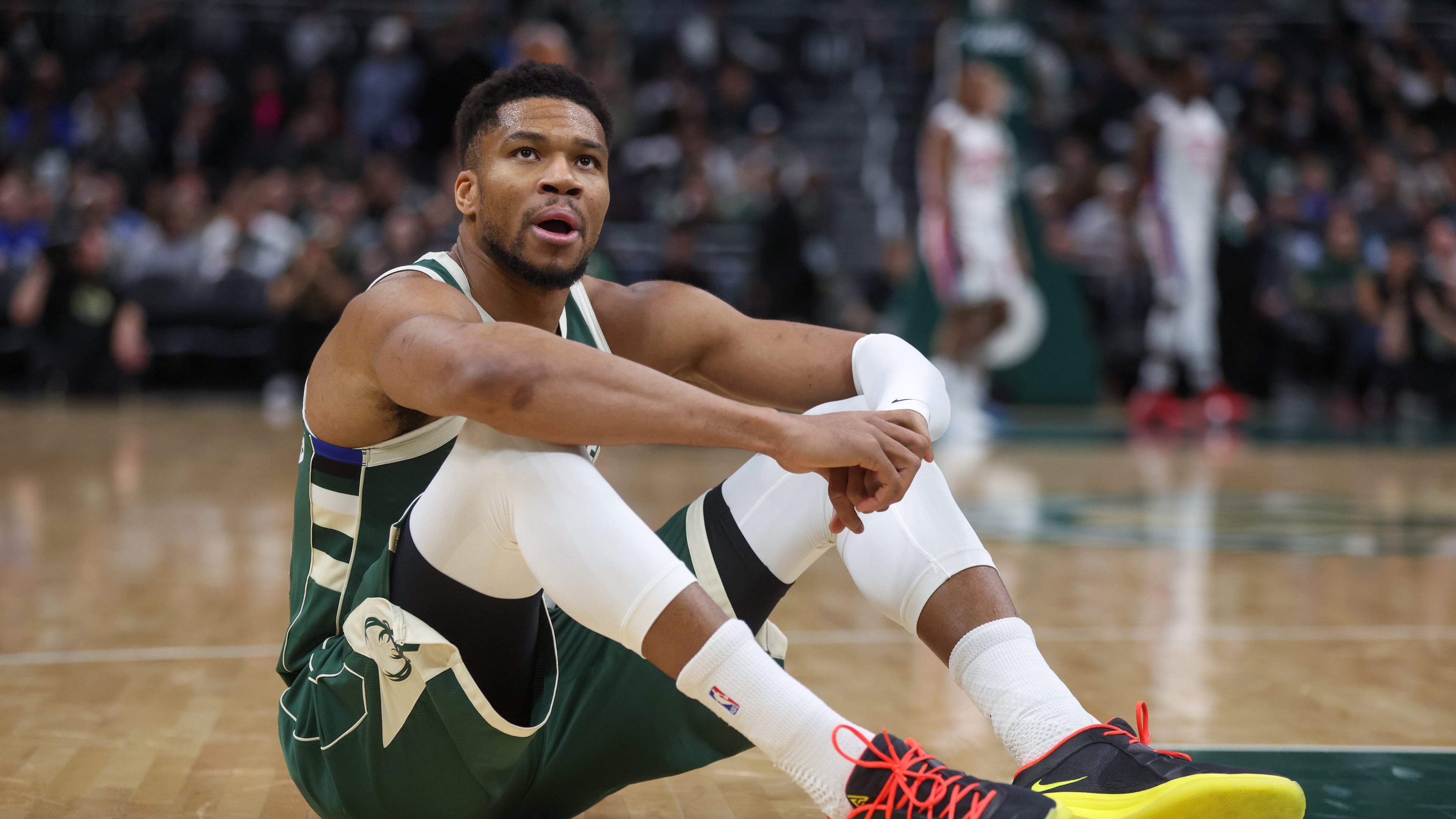 Milwaukee Bucks' Giannis Antetokounmpo reacts after suffering an injury during the first half an NBA basketball game against the Detroit Pistons, Wednesday, Dec. 3, 2025, in Milwaukee. (AP Photo/Kylie Bridenhagen)