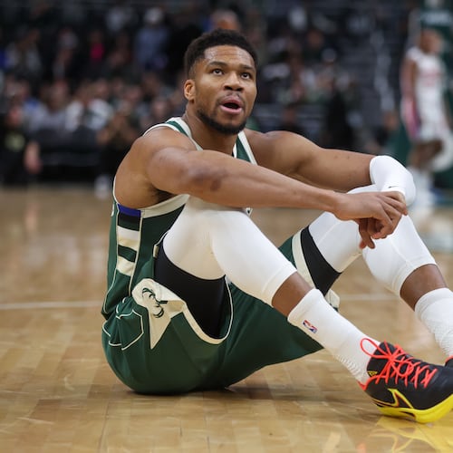 Milwaukee Bucks' Giannis Antetokounmpo reacts after suffering an injury during the first half an NBA basketball game against the Detroit Pistons, Wednesday, Dec. 3, 2025, in Milwaukee. (AP Photo/Kylie Bridenhagen)
