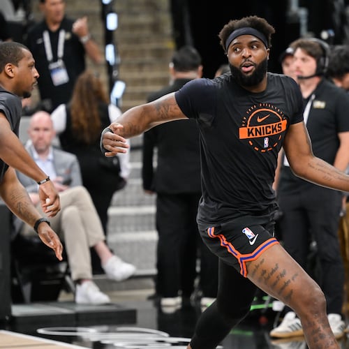 New York Knicks center Mitchell Robinson warms up prior to Game 5 of the NBA Finals basketball series against the San Antonio Spurs, Saturday, June 13, 2026, in San Antonio. (AP Photo/Darren Abate)