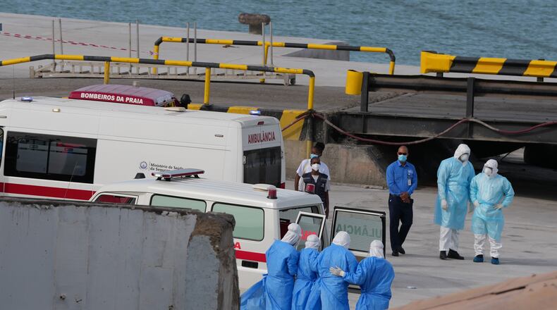 Health workers in protective gear evacuate patients from the MV Hondius cruise ship at a port in Praia, Cape Verde, Wednesday, May 6, 2026. (AP Photo/Misper Apawu)