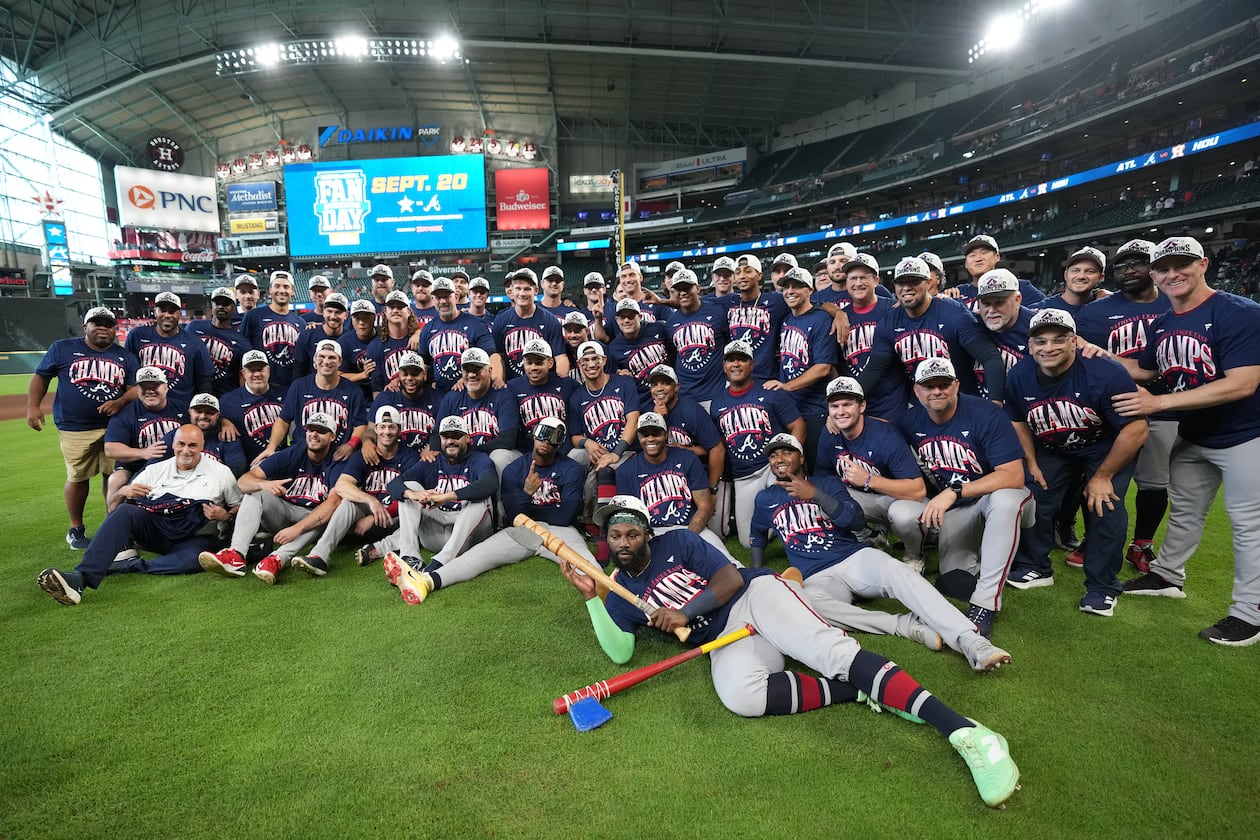 Atlanta Braves players and coaches take a group photo on the field after a baseball game against the Houston Astros as the Braves clinched the NL East title, Sunday, Sept. 20, 2026, in Houston. (Karen Warren/AP)