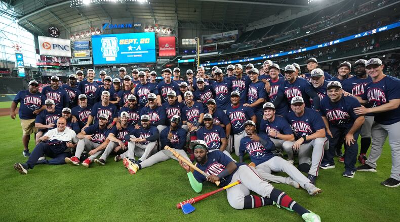 Atlanta Braves players and coaches take a group photo on the field after a baseball game against the Houston Astros as the Braves clinched the NL East title, Sunday, Sept. 20, 2026, in Houston. (Karen Warren/AP)
