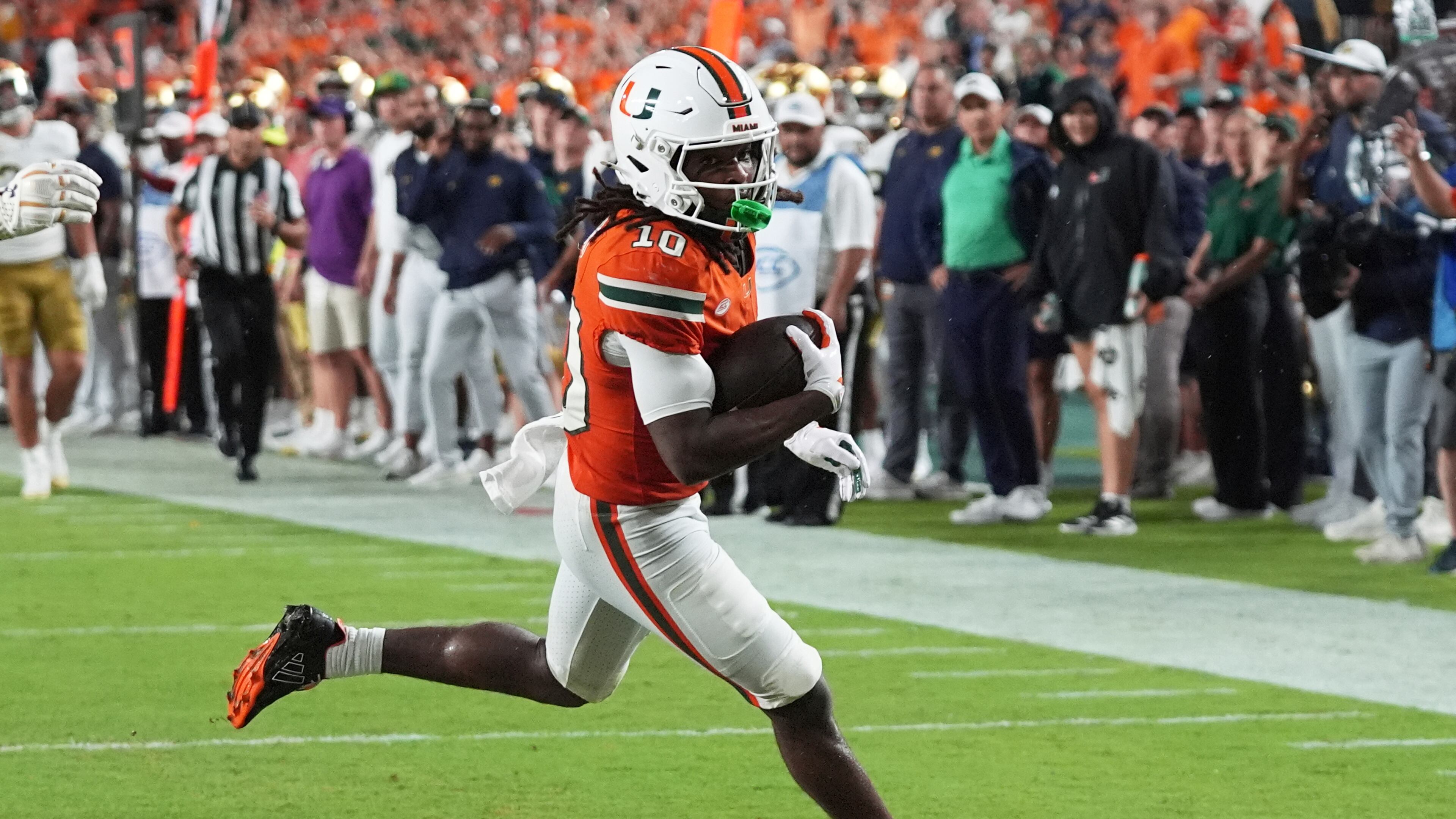 Miami wide receiver Malachi Toney scores a touchdown during the first half of an NCAA college football game against Notre Dame, Sunday, Aug. 31, 2025, in Miami Gardens, Fla. (AP Photo/Lynne Sladky)