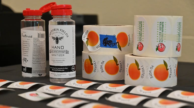 Voting stickers and hand sanitizers are ready for use during the Georgia primary elections at Pinckneyville Community Center in Norcross on Tuesday, June 9, 2020. (Hyosub Shin / Hyosub.Shin@ajc.com)
