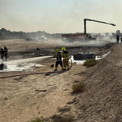 Emergency services attend the scene after an Indian HAL Tejas crashed during a demonstration at the Dubai Air Show, at Al Maktoum International Airport at Dubai World Central, Dubai, United Arab Emirates, Friday Nov. 21, 2025. (Dubai Media Office via AP)