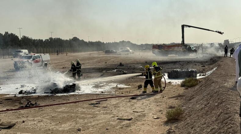 Emergency services attend the scene after an Indian HAL Tejas crashed during a demonstration at the Dubai Air Show, at Al Maktoum International Airport at Dubai World Central, Dubai, United Arab Emirates, Friday Nov. 21, 2025. (Dubai Media Office via AP)