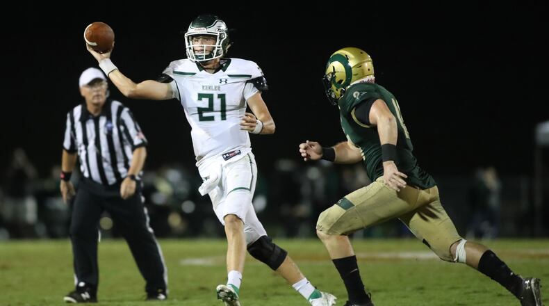 Collins Hill quarterback Samuel Horn (21) attempts a pass in the second half against Grayson at Grayson High School Friday, September 18, 2020 in Loganville, Ga.. Grayson won 28-7. (Jason Getz/Special to the AJC)