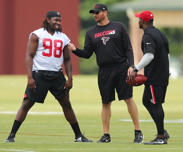 May 12, 2017, Flowery Branch: Falcons first-round pick rookie defensive end/linebacker Takkarist McKinley, UCLA, talks with coaches during rookie mini-camp on Friday, May 12, 2017, in Flowery Branch. Curtis Compton/ccompton@ajc.com