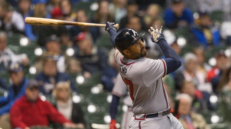 Braves’ Matt Kemp watches his third home run fly over the right field wall during the eighth inning Saturday. (AP Photo/Tom Lynn)
