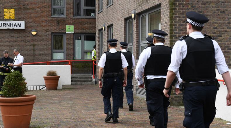 Police officers arrive at Burnham Tower residential block on the Chalcots Estate in north London on Saturday as residents evacuate because of fire safety concerns. 
Residents of 650 London flats were evacuated due to fire safety fears in the wake of the Grenfell Tower tragedy, but 83 people refused to leave their homes, according to local officials.