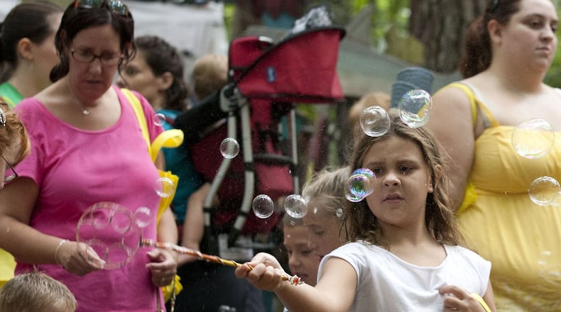 The Yellow Daisy Festival at Stone Mountain Park will feature more than 400 artists from across the country, plus food and entertainment. It will be held Sept. 5-8 this year. KELLY J. HUFF/SPECIAL