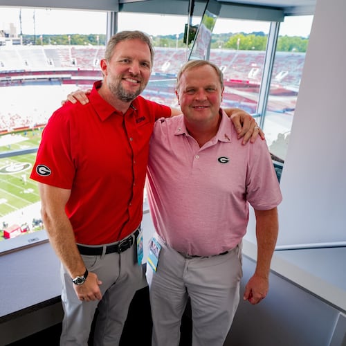 New Georgia Bulldogs radio play-by-play voice Jeff Dantzler (right) poses with Bulldogs football great and radio analyst Jon Stinchcomb before the season opener against Tennessee State at Sanford Stadium Sept. 5, 2026. (Tony Walsh/UGAAA)