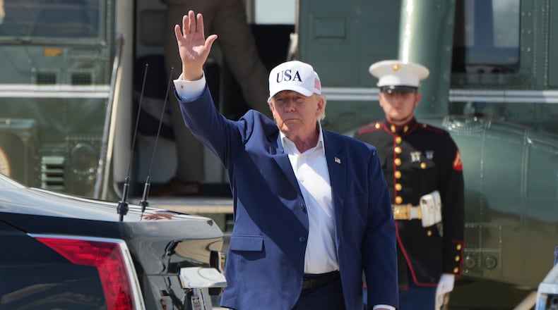President Donald Trump waves as he arrives on Marine One at Joint Base Andrews, Md., Sunday, June 21, 2026, following a trip to Camp David. (AP Photo/Mark Schiefelbein)