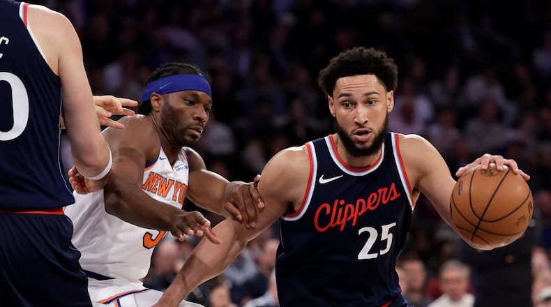 FILE - LA Clippers guard Ben Simmons drives past New York Knicks forward Precious Achiuwa during the first half of an NBA basketball game in New York, March 26, 2025. (AP Photo/Adam Hunger, File)