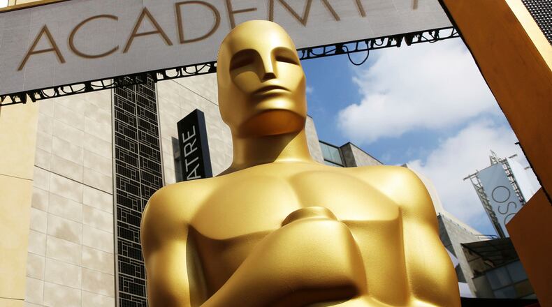 FILE - An Oscar statue appears outside the Dolby Theatre for the 87th Academy Awards in Los Angeles on Feb. 21, 2015. (Photo by Matt Sayles/Invision/AP, File)