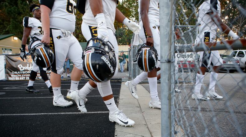 Colquitt County players before the start of a 2018 game. (Casey Sykes for The Atlanta Journal-Constitution)