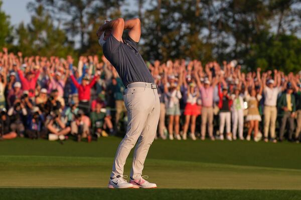 Rory McIlroy, of Northern Ireland, celebrates winning in a playoff against Justin Rose, of England, after the final round the Masters golf tournament, Sunday, April 13, 2025, in Augusta, Ga. (AP Photo/Matt Slocum)