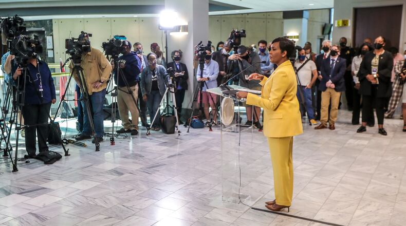 May 7, 2021 Atlanta: Atlanta Mayor Keisha Lance-Bottoms held a press conference Friday, May 7, 2021 at Atlanta City Hall speaking about her decision not to run for a second term. In her first public appearance since announcing her decision to supporters Thursday night, Bottoms said her decision was guided by faith. “In the same way that it was very clear to me almost five years ago that I should run for mayor of Atlanta, it is abundantly clear to me today that it is time to pass the baton on to someone else,” Bottoms said at an emotional news conference at City Hall. She added that “the last three years have not been at all what I would have scripted for our city,” referencing a crippling cyber attack, a widening federal corruption investigation into the previous administration, the COVID-19 pandemic and civil unrest last year. Bottoms said she doesn’t know what’s next for her; she denied rumors that she or her husband Derek have taken jobs for Walgreens out of state. “I can’t get Derek to move two miles off Cascade Road,” she said. Bottoms, who was seen as a strong incumbent candidate despite a spike in violent crime, told friends and supporters Thursday evening she won’t seek a second term. She released a video and statement online a few hours later elaborating on her decision and reflecting on her time in office. “This is not something I woke up and decided yesterday,” Bottoms said Friday. “This is something I’ve been thinking about for a very long time.” (John Spink / John.Spink@ajc.com)