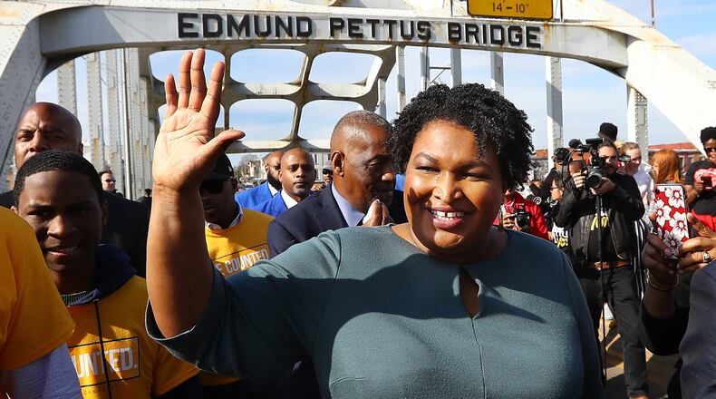 Former candidate for Georgia governor Stacey Abrams crosses the Edmund Pettus Bridge during Selma's re-enactment of Bloody Sunday on Sunday, March 1, 2020, in Selma, Alabama. Abrams is expected to mount a rematch against Gov. Brian Kemp to try to avenge her narrow defeat in 2018.  (Curtis Compton/Atlanta Journal-Constitution/TNS)