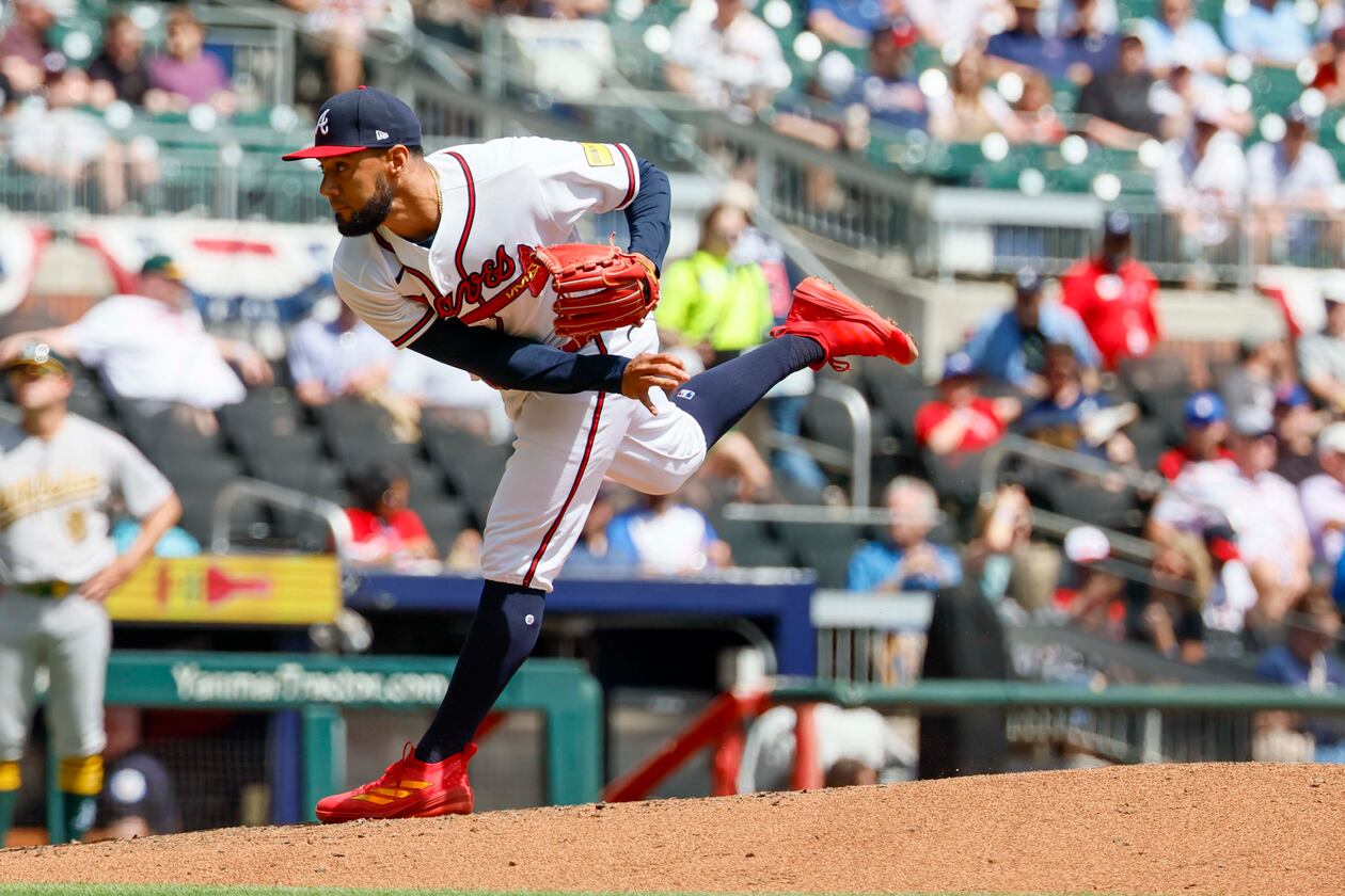 Atlanta Braves pitcher Robert Suarez delivers to an Athletics batter during the sixth inning at Truist Park on Wednesday, April 1, 2026. (Miguel Martinez/AJC)