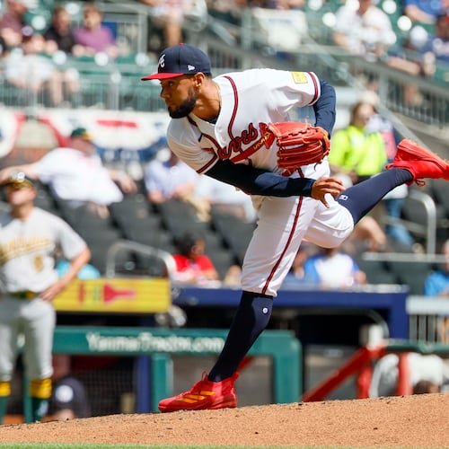 Atlanta Braves pitcher Robert Suarez delivers to an Athletics batter during the sixth inning at Truist Park on Wednesday, April 1, 2026. (Miguel Martinez/AJC)