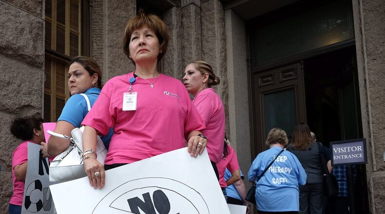 Opponents of  proposed budget cut in therapy services from the Medicaid program for children with disabilities and the elderly waited in line to speak with Texas lawmakers. (File)