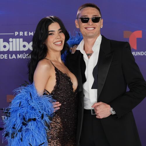 Kenia Os and Peso Luma arrive at the Latin Billboard Awards Thursday, Oct. 23, 2025, in Miami. (AP Photo/Marta Lavandier)