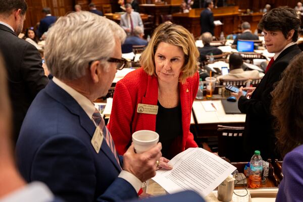 Speaker Pro Tem Jan Jones, R-Milton, talks with a House colleague at the Capitol in Atlanta on Friday, the final day of the legislative session. 
