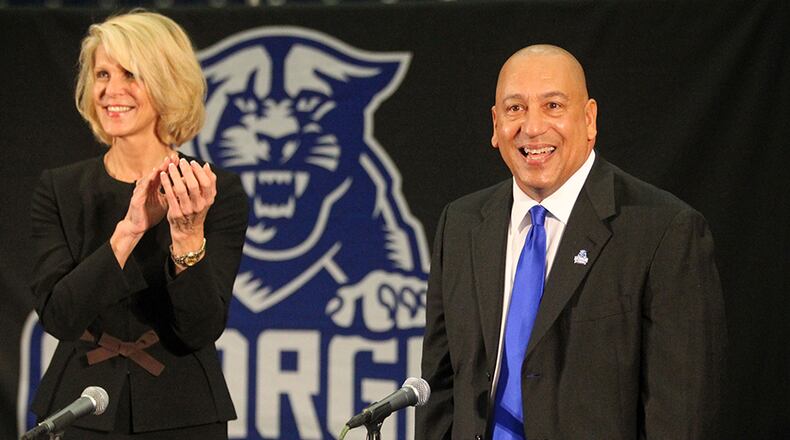 New Georgia State football coach Trent Miles is introduced by athletic director Cheryl Levick (left) at his introductory press conference at the GSU Sports Arena Dec. 3, 2012, in Atlanta.