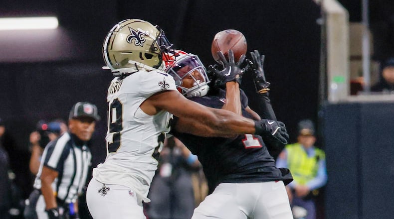 Atlanta Falcons wide receiver Darnell Mooney (1) attempts a catch as the New Orleans Saints cornerback Paulson Adebo (29) was called pass interference during the second half of an NFL football game against the New Orleans Saints on Sunday, Sept. 29, at Mercedes-Benz Stadium in Atlanta.
(Miguel Martinez/ AJC)