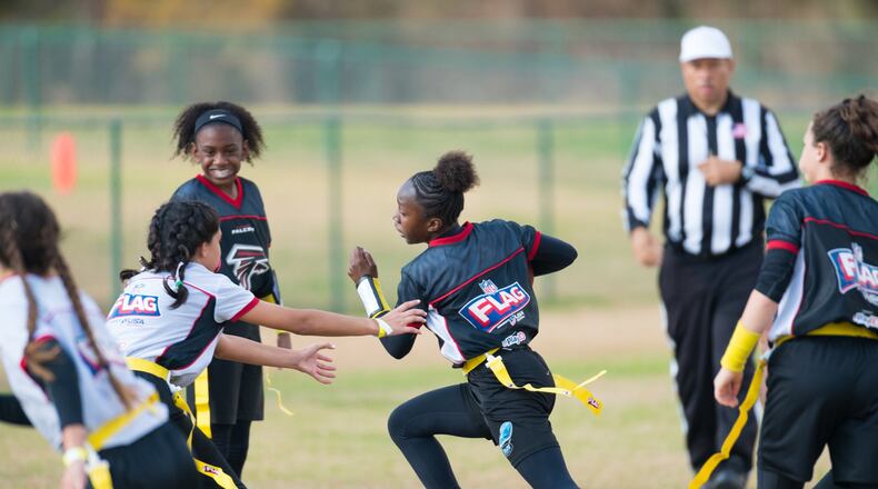 Girls in this NFL camp are playing flag football. In a program starting this fall, all 20 Gwinnett County public high schools will have girls flag football teams that will compete against each other in a five-game series. Courtesy of The Arthur M. Blank Family Foundation