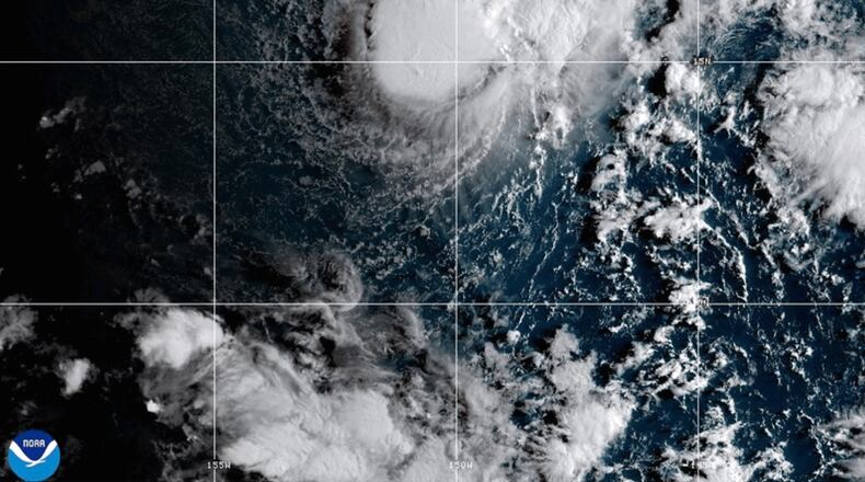 This NOAA satellite image taken Saturday, Aug. 22, 2026, shows Tropical Storm Moke advancing towards Hawaii in the Pacific Ocean. (NOAA via AP)