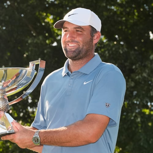 Scottie Scheffler holds the trophy after winning the PGA Tour Championship golf tournament Sunday, Aug. 30, 2026, in Atlanta. (AP Photo/Mike Stewart)