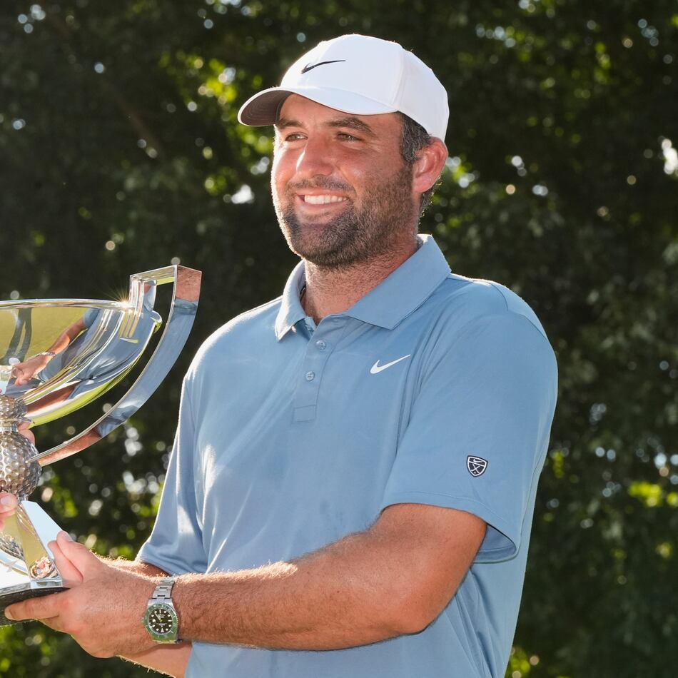 Scottie Scheffler holds the trophy after winning the PGA Tour Championship golf tournament Sunday, Aug. 30, 2026, in Atlanta. (AP Photo/Mike Stewart)