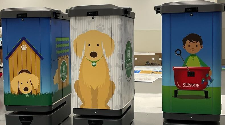 Electronic machines at the new Arthur M. Blank Hospital called “robos” are wrapped in images that represent the facility.