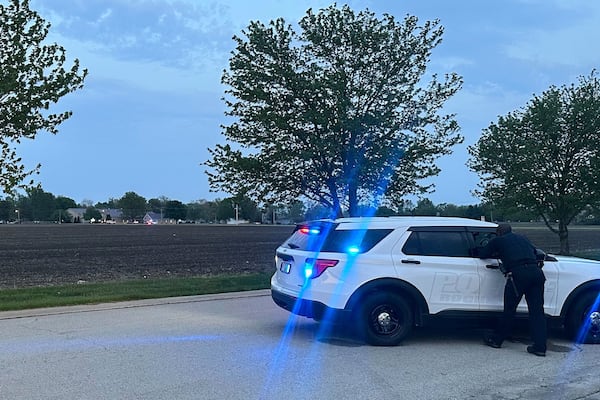 Police block a road leading to a building where a car smashed through during an after-school program, killing several people and injuring others, Monday, April 28, 2025, in Chatham, Ill. (AP Photo/John O'Connor)