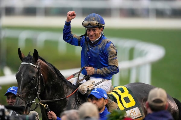 Junior Alvarado celebrates after riding Sovereignty to victory in the 151st running of the Kentucky Derby horse race at Churchill Downs Saturday, May 3, 2025, in Louisville, Ky. (AP Photo/Brynn Anderson)
