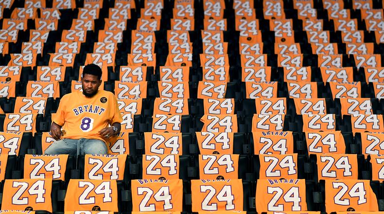 Usher sits alone in the stands at Staples Center before his performance in a ceremony honoring the recently deceased Lakers star before a game against the Portland Trailblazers in Los Angeles on Friday, Jan. 31, 2020. (Wally Skalij/Los Angeles Times/TNS)