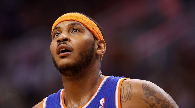 Carmelo Anthony #7 of the New York Knicks during the NBA game against the Phoenix Suns at US Airways Center on March 28, 2014 in Phoenix, Arizona. The Suns defeated the Knicks 112-88. NOTE TO USER: User expressly acknowledges and agrees that, by downloading and or using this photograph, User is consenting to the terms and conditions of the Getty Images License Agreement. (Photo by Christian Petersen/Getty Images)