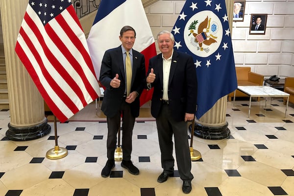 Sen. Richard Blumenthal, D-Conn., left, and Sen. Lindsey Graham, R-S.C thumb up during a news event at the US embassy to France, Sunday, June 1, 2025 in Paris. (AP Photo/Thomas Adamson)