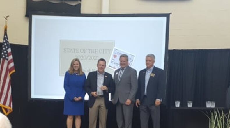 Smyrna Mayor Derek Norton, second from left, was named the 2020 Citizen of the Year by the Cobb Chamber. Norton delivered his inaugural State of the City on Wednesday night. (Photo by Matt Bruce/for the AJC)