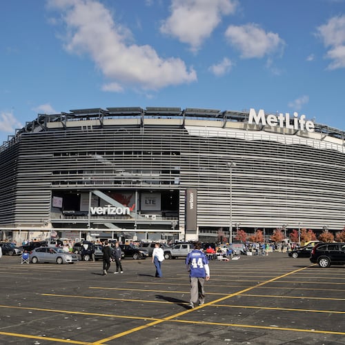 FILE - Tailgaters gather outside MetLife Stadium before an NFL football game between the New York Giants and the Philadelphia Eagles, Sunday, Nov. 6, 2016, in East Rutherford, N.J. (AP Photo/Frank Franklin II, File)
