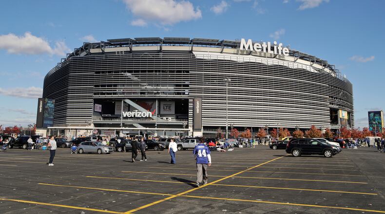FILE - Tailgaters gather outside MetLife Stadium before an NFL football game between the New York Giants and the Philadelphia Eagles, Sunday, Nov. 6, 2016, in East Rutherford, N.J. (AP Photo/Frank Franklin II, File)