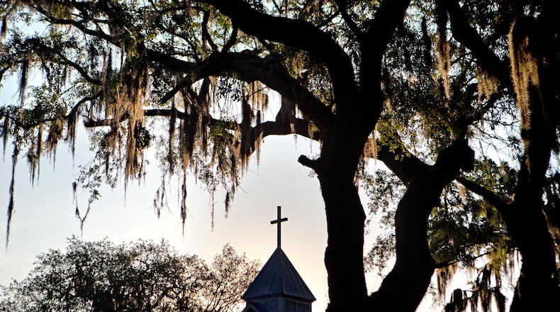 The sun rises behind St. Luke Baptist Church in the Hog Hammock community of Sapelo Island, Ga., on Friday, May 17, 2013. (Courtesy of David Goldman)